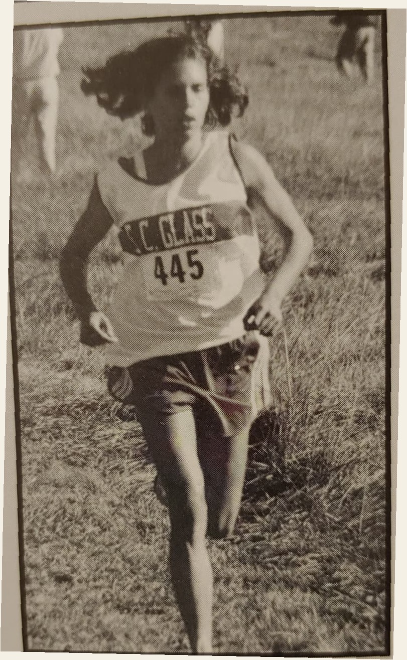 Cassie racing cross country for E.C. Glass High School